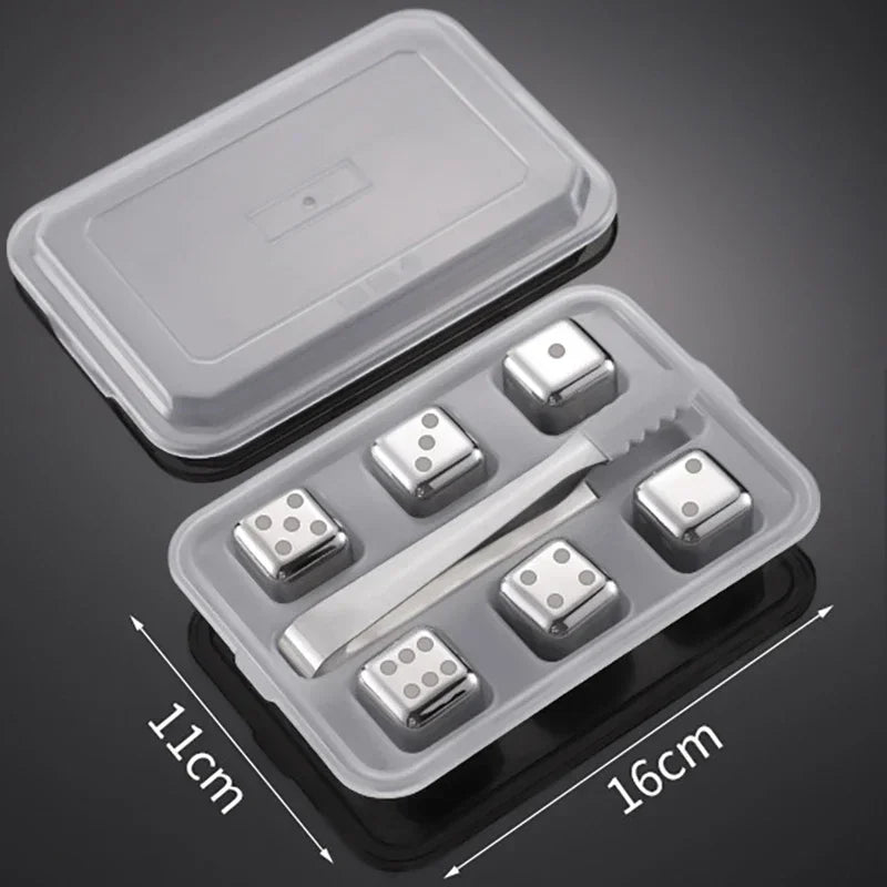 Set of metal dice with a clear plastic container on a dark background