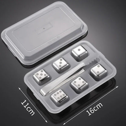 Set of metal dice with a clear plastic container on a dark background