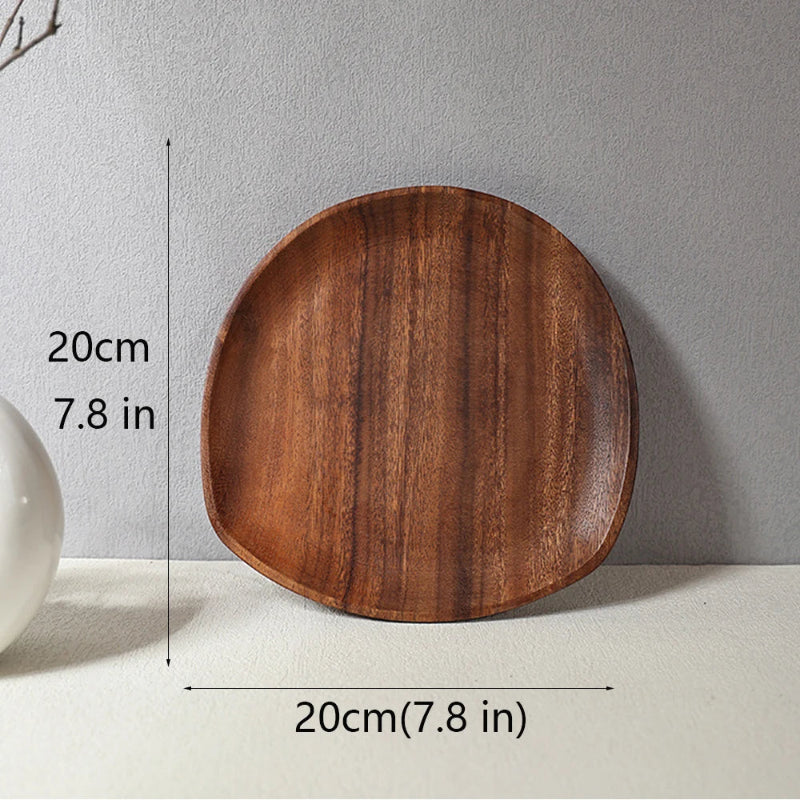 Asymmetrically shaped wooden serving tray with dimensions: 20 cm (7.8 in) long and 20 cm (7.8 in) wide.