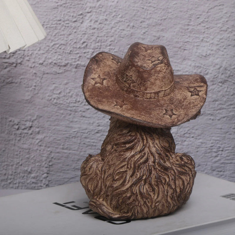 Decorative item with a cowboy hat on a textured surface
