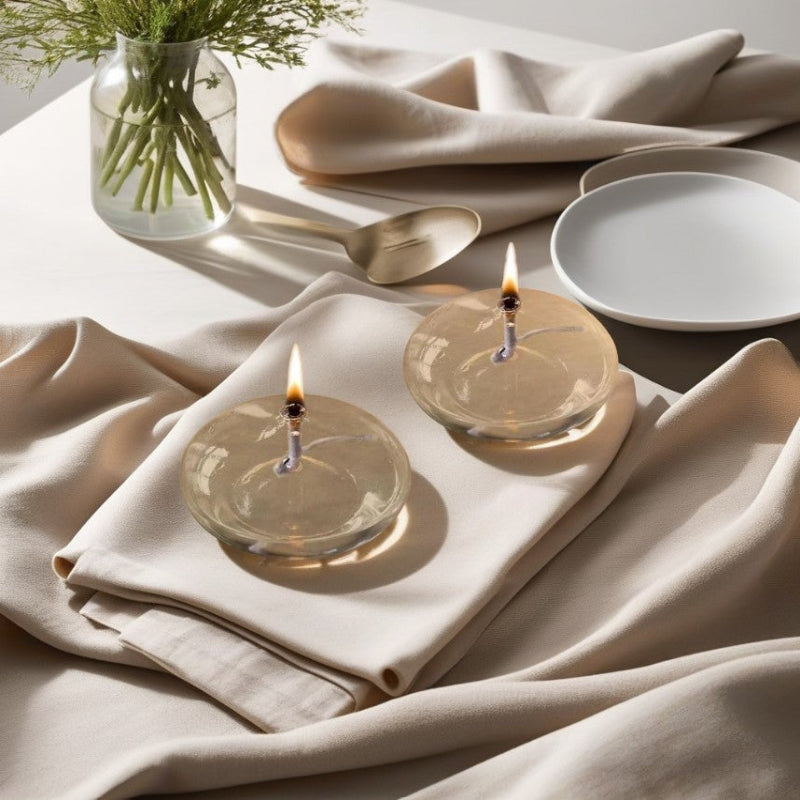 Refillable oil candle with a sleek glass body, adding ambiance to any space.