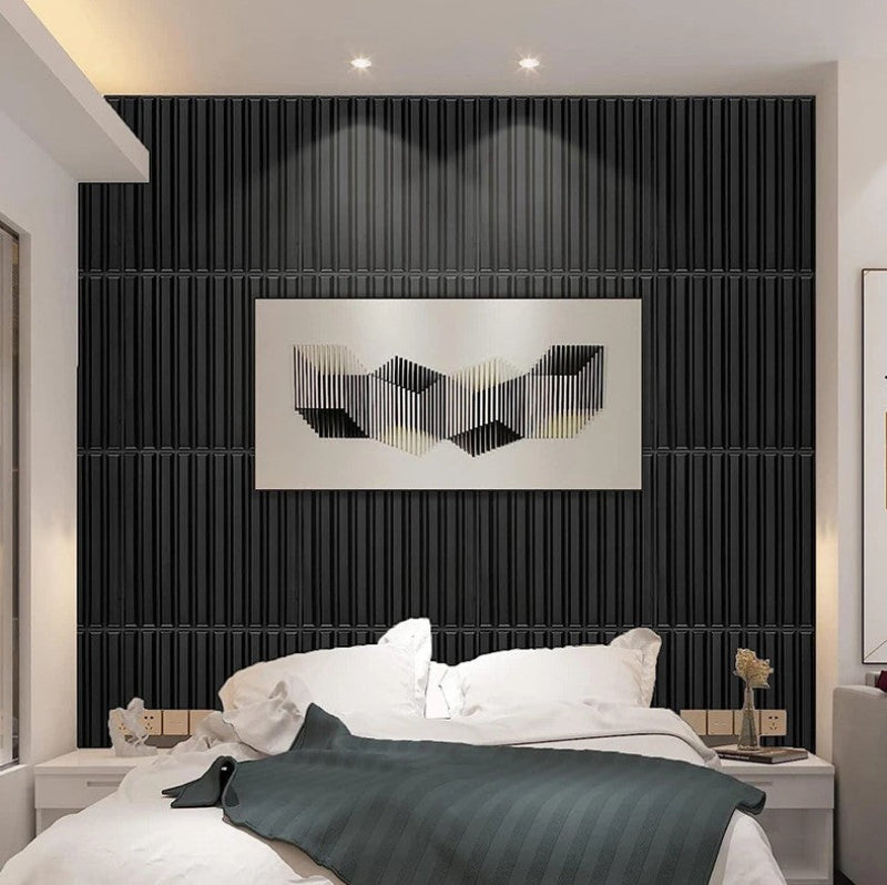 Modern bedroom with black textured wall, abstract art, and white bedding.
