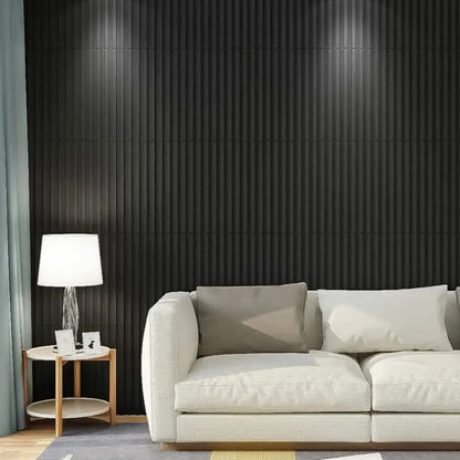 Modern living room with a white sofa against a black paneled wall.