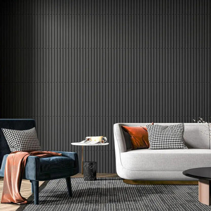 Modern living room with a gray sofa, blue armchair, and black wall.