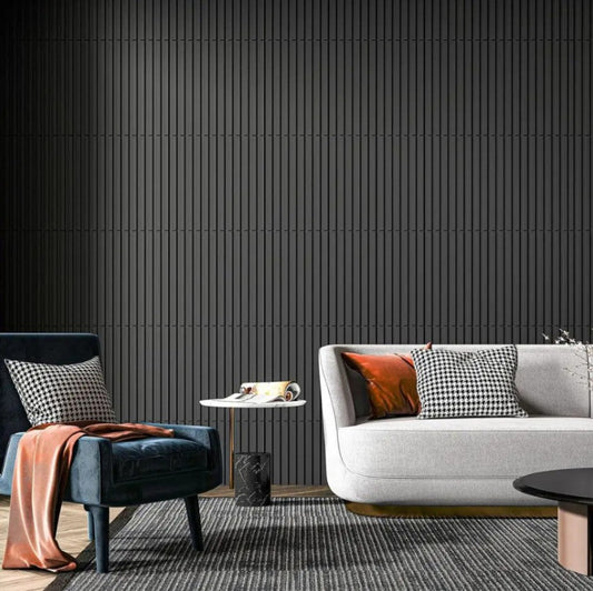 Modern living room with a gray sofa, blue armchair, and black wall.