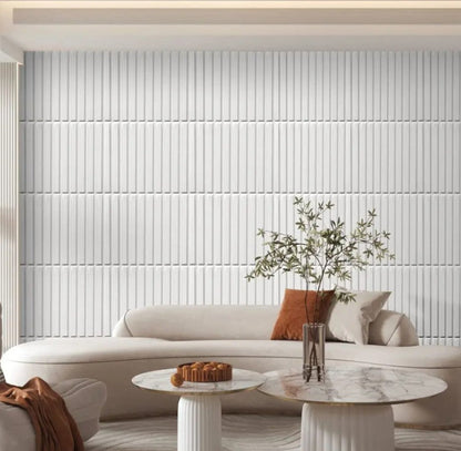 Modern living room with a white sofa, marble coffee table, and decorative elements.