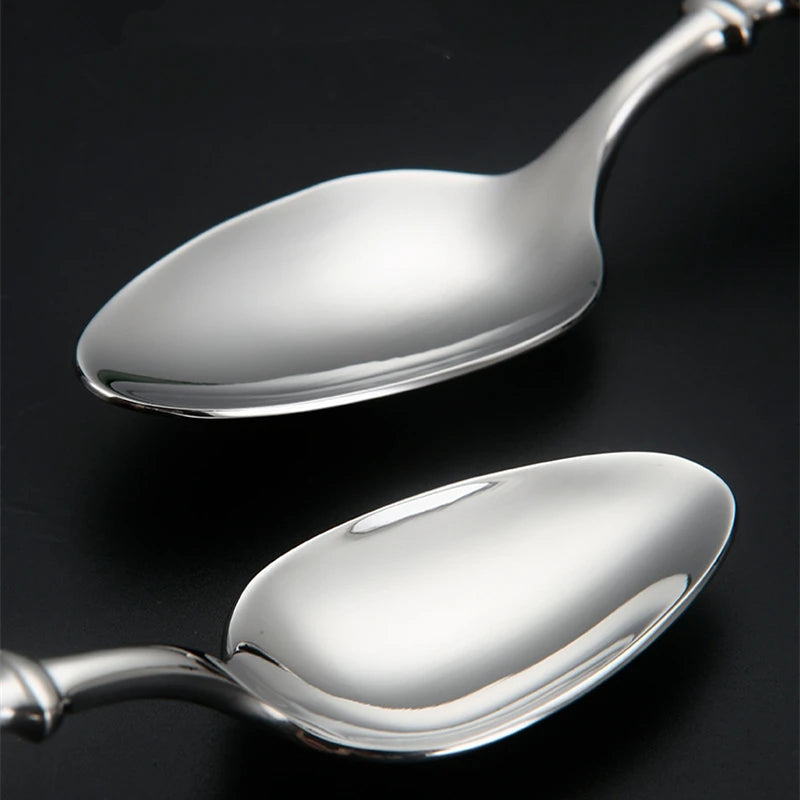 Two polished silver spoons
