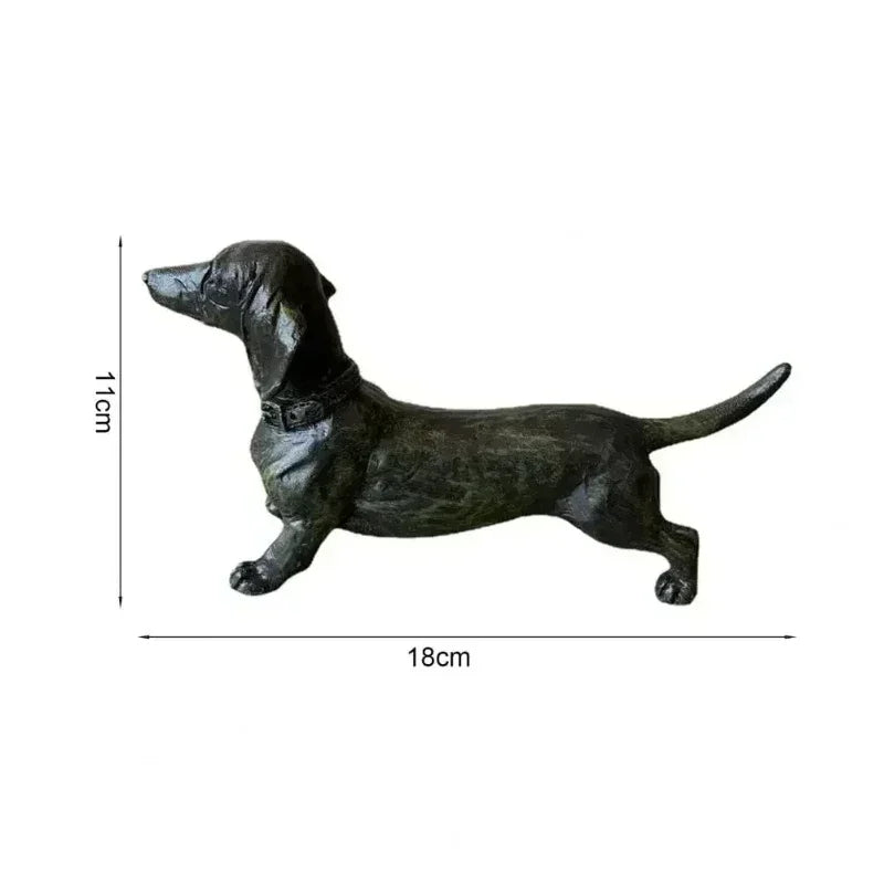 Black dachshund figurine with dimensions 18cm by 11cm.