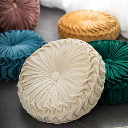Round textured cushions in various colors on a dark surface