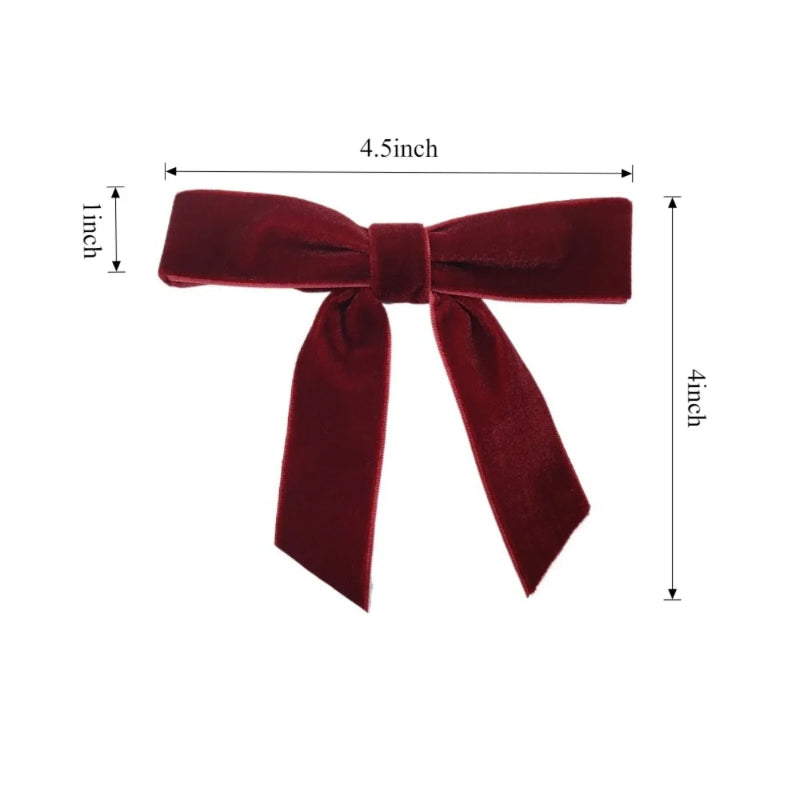 Red velvet bow with measurements on a white background