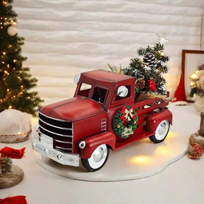 Red vintage toy truck with Christmas tree.