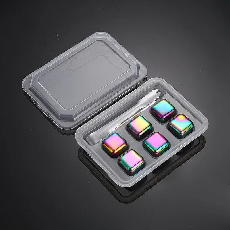 Set of colorful stones in a clear plastic container on a dark background