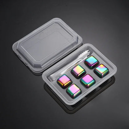 Set of colorful stones in a clear plastic container on a dark background