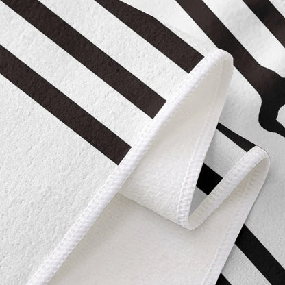 White towel with black stripes on a white background