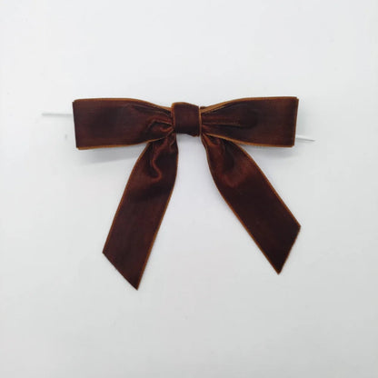 Brown velvet bow on a white background