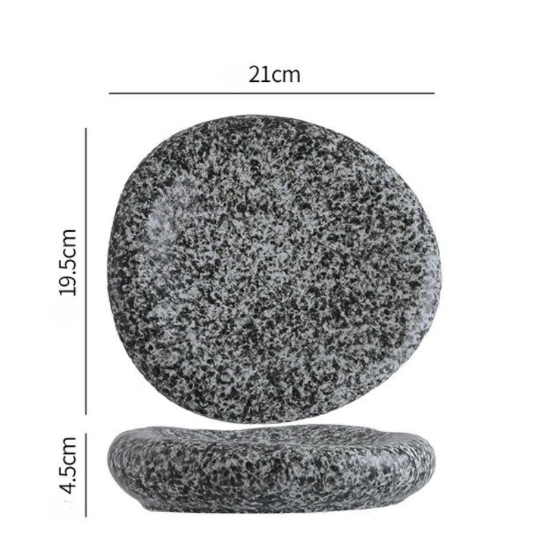 Two gray stones with measurements on a white background