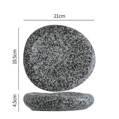 Two gray stones with measurements on a white background