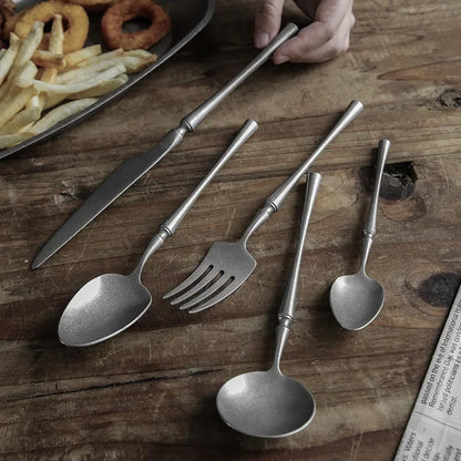Set of rustic silverware on wood