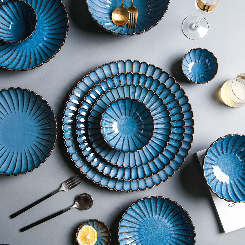 An overhead shot of a blue dinnerware set.