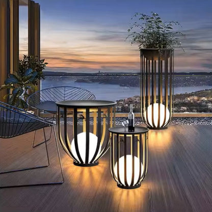 Sustainable solar table featuring solar panels for lighting, perfect for a cozy garden setting.