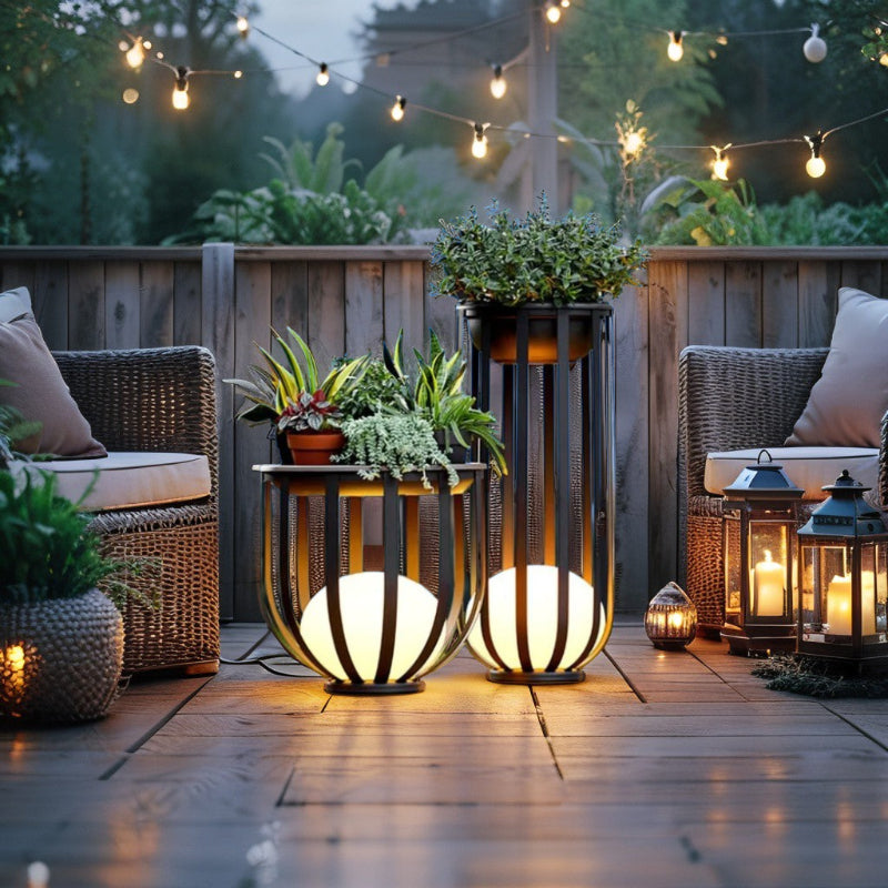 Solar planter tables with integrated light glowing on patio at dusk