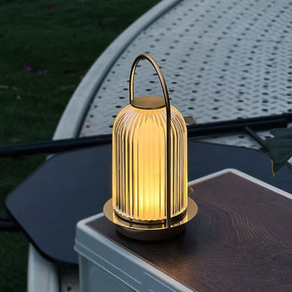 Decorative outdoor lamp on a table with a blurred background