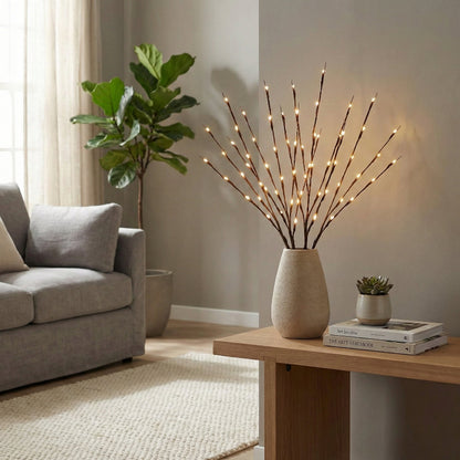 Decorative vase with lights on a wooden table in a living room setting.