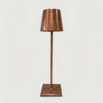 Allegra dimmable cordless table lamp in copper on white background