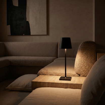 Allegra dimmable cordless table lamp in black on side table in living room