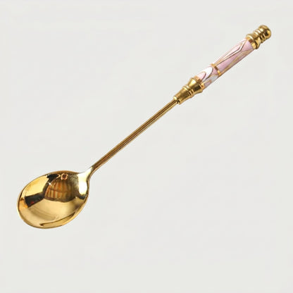 Pink Amalfi dessert spoon on white background