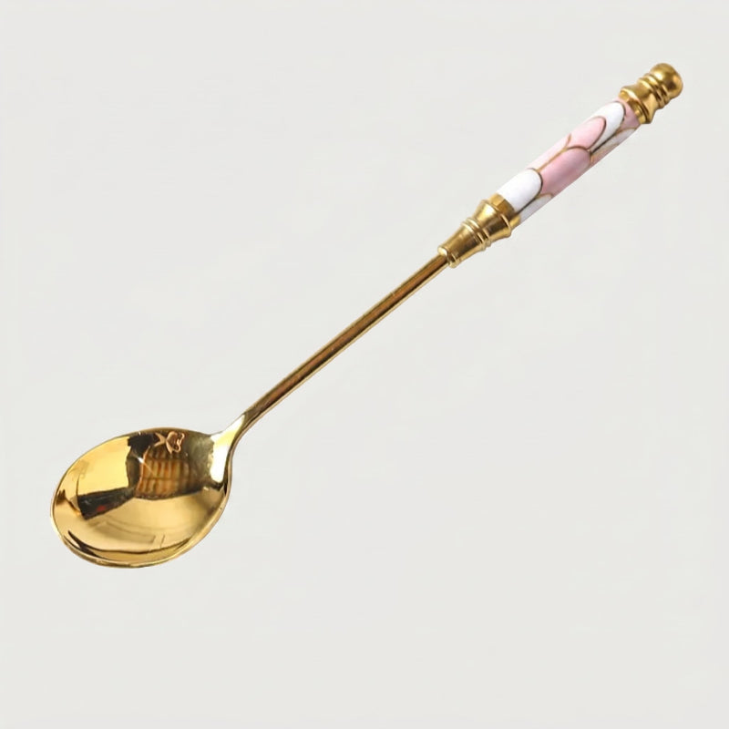 Pink Amalfi dessert spoon on white background