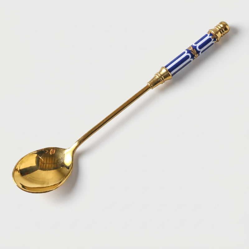 Blue Amalfi dessert spoon on white background