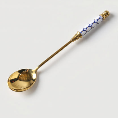 Blue Amalfi dessert spoon on white background