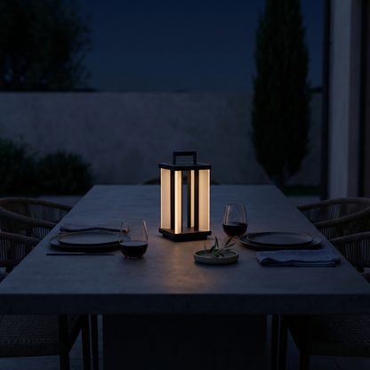Architectural outdoor solar lanterns on outdoor dining table at night