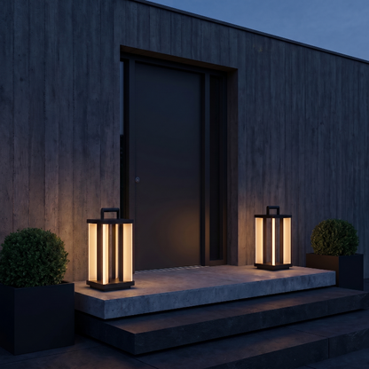 Architectural outdoor solar lanterns by front entry steps at night