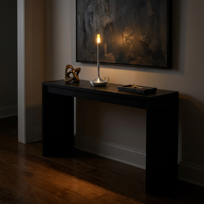 Arlo cordless aluminum table lamp on console table in moody interior