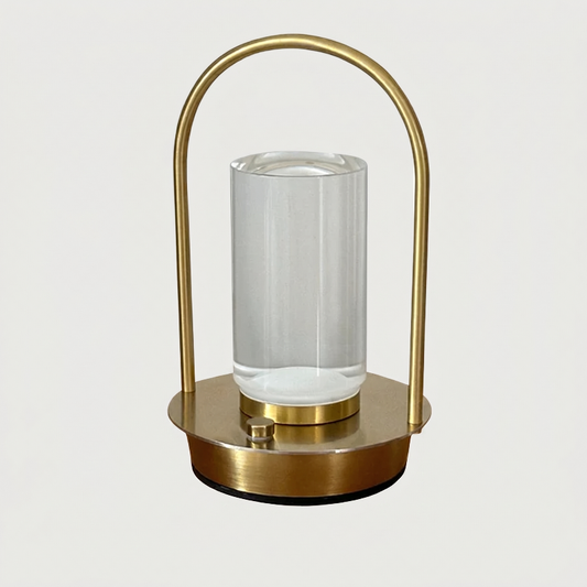 Aura portable crystal table lamp in gold on white background