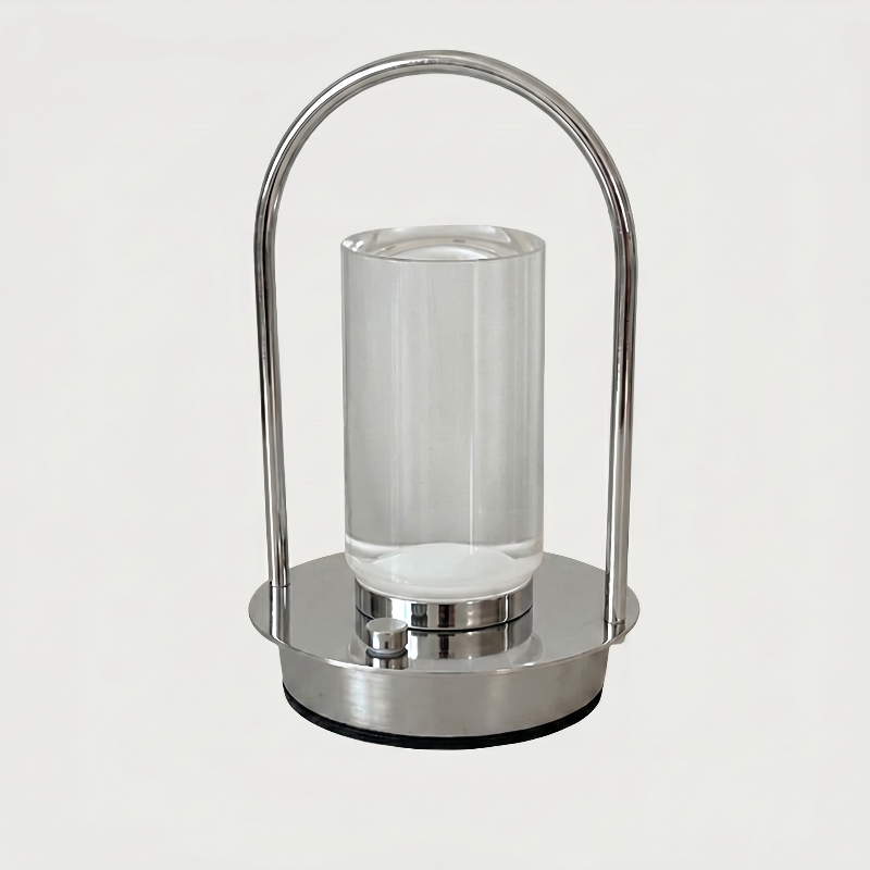 Aura portable crystal table lamp in silver on white background