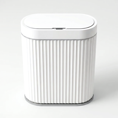 White ribbed automatic smart sensor trash can with grey trim and infrared sensor lid on a clean off-white background