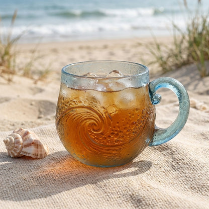 Beach sea glass wave mug with an iced drink on the sand, Kiyo Home