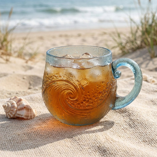 Beach sea glass wave mug with an iced drink on the sand, Kiyo Home