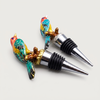 Kingfisher and magpie enamel bird wine bottle stoppers shown together on a clean off-white background