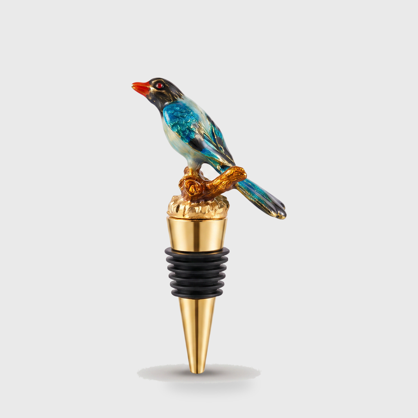 Magpie enamel bird wine bottle stopper with a gold finish on a clean off-white background