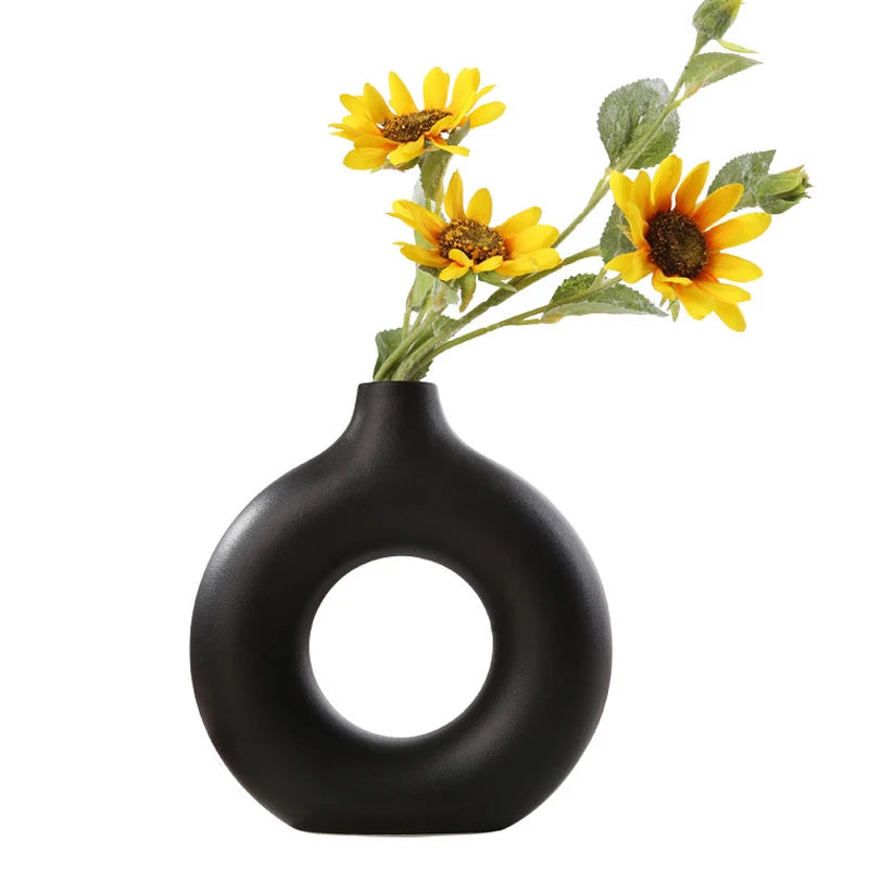 Contemporary circular vase, ideal for creating a focal point in your home decor.