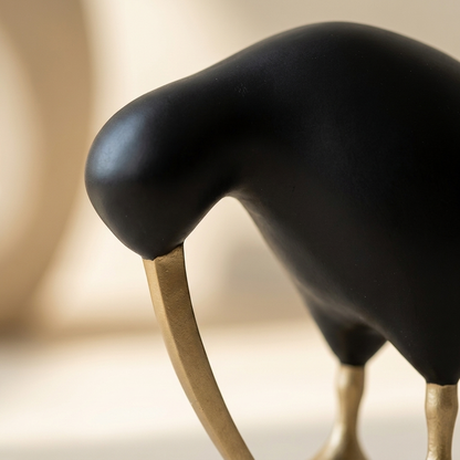Close-up of the Black Kiwi Bird Sculpture's matte black finish and gold-tone beak and feet