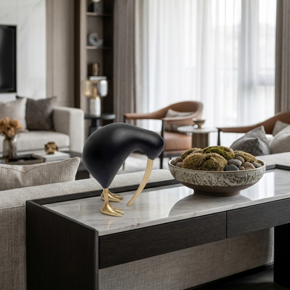 Black Kiwi Bird Sculpture styled on a console table in a living room