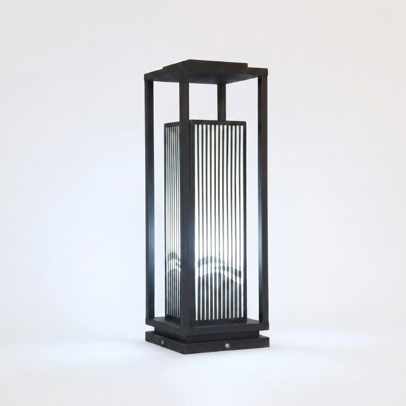 Black outdoor lamp with glass panel on a white background