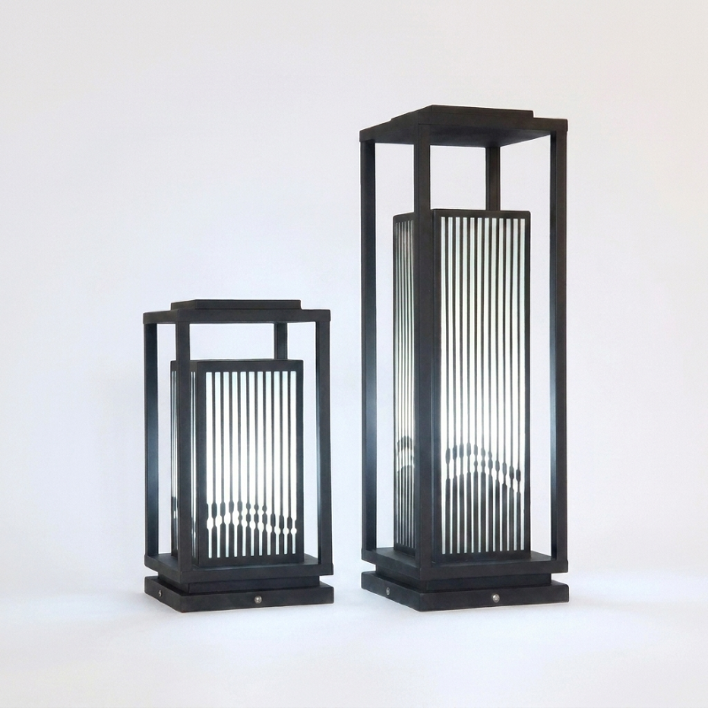 Black metal LED solar outdoor lanterns on white background
