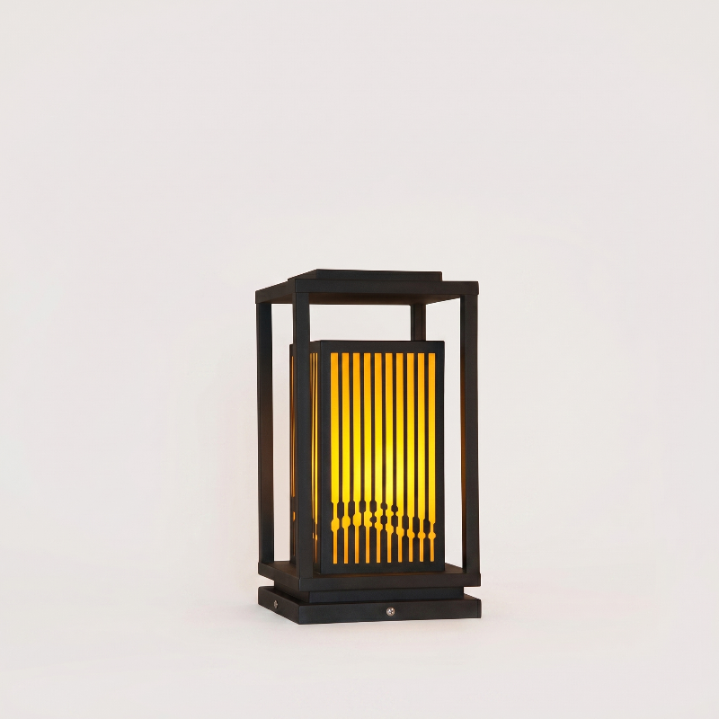 Decorative outdoor lamp with black frame and yellow interior on a white background
