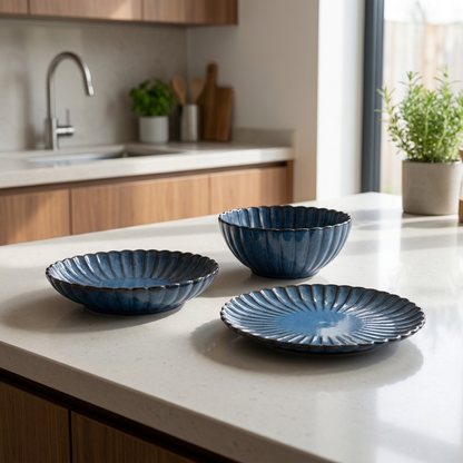 Blue ribbed ceramic dinnerware collection displayed on a kitchen counter, Kiyo Home 22-piece set